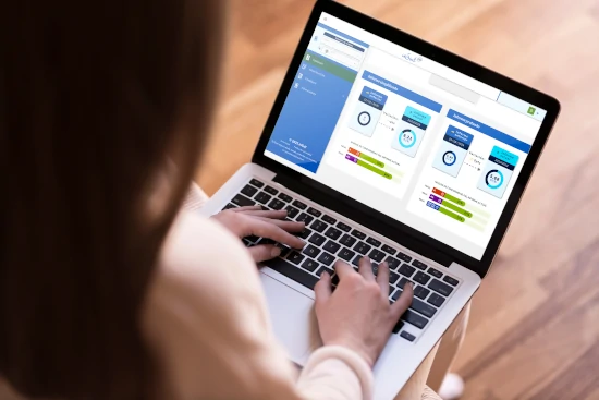 A girl working on a PC laptop.