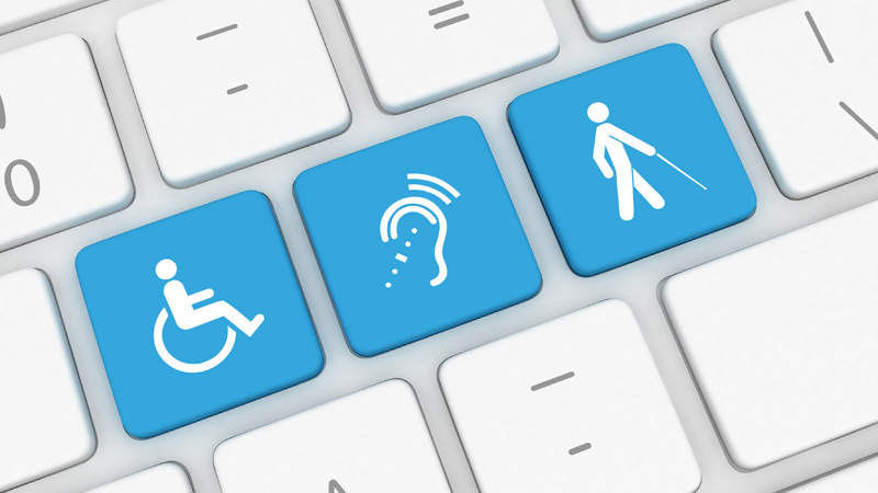 Clavier d'ordinateur montrant trois grandes touches bleues avec des icônes liées à l'accessibilité