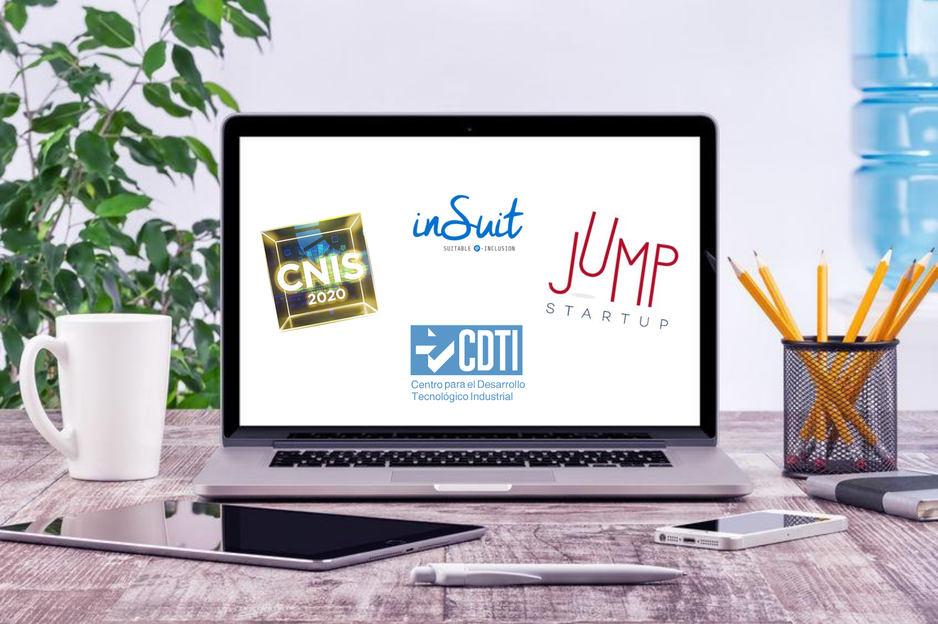 ordenador portátil muestra en su pantalla los logos de insuit, cnis, jump startup y cdti centro para el desarrollo tecnológico industrial