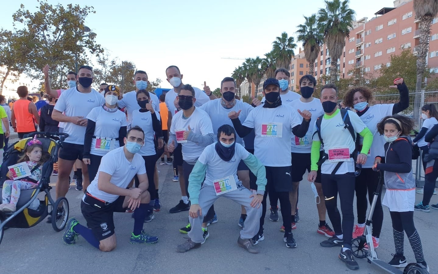 insuit team members pose on the street just before the start of the race.